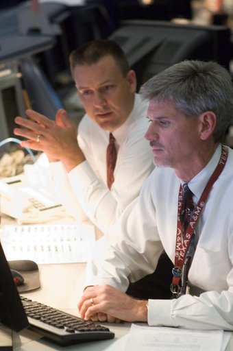 STS-120 Flight Controllers on console during mission