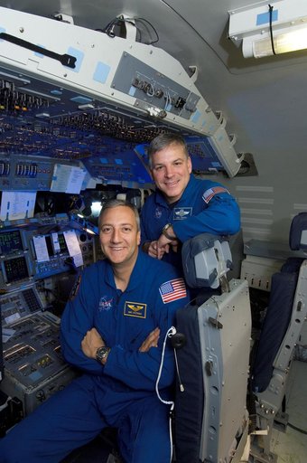 STS-125 Astronauts Massimino and Johnson pose for Magazine Cover