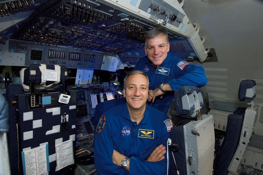 STS-125 Astronauts Massimino and Johnson pose for Magazine Cover