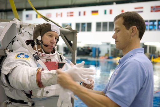 STS-127 astronauts Dave Wolf and Tim Kopra during STS-127 2J/A EVA training at the NBL