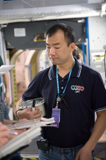 Expedition 22 crew member Soichi Noguchi performing emergency procedure training.