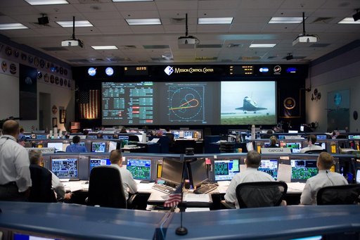 STS-125 Entry flight controllers on console with Flight Director Norman Knight