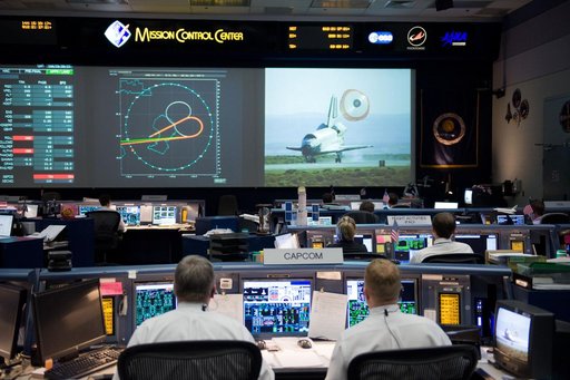 STS-125 Entry flight controllers on console with Flight Director Norman Knight