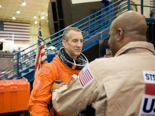 STS-129 Preflight Training. Suited payload egress training.