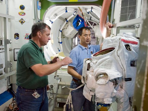 Expedition 22 crew member TJ Creamerand, JAXA astronaut Soichi Noguchi and Expedition 28 crew member Satoshi Furukawa