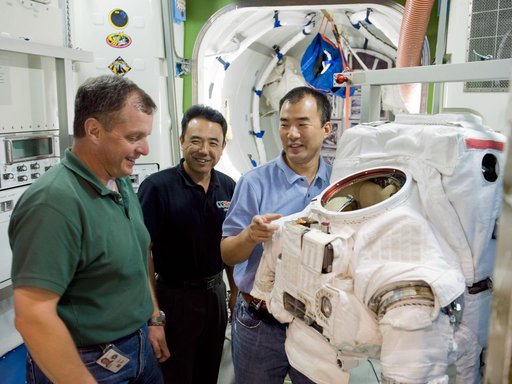 Expedition 22 crew member TJ Creamerand, JAXA astronaut Soichi Noguchi and Expedition 28 crew member Satoshi Furukawa