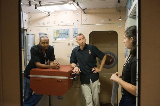 STS-129 crew during trans hands-on review in the space station mockups.