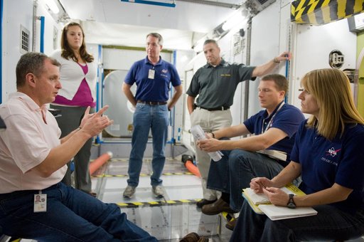 STS-130 crew and Expedition 22 crew member T.J. Creamer during module outfitting training.