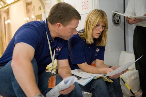 STS-130 crew and Expedition 22 crew member T.J. Creamer during module outfitting training.