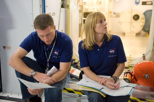 STS-130 crew and Expedition 22 crew member T.J. Creamer during module outfitting training.