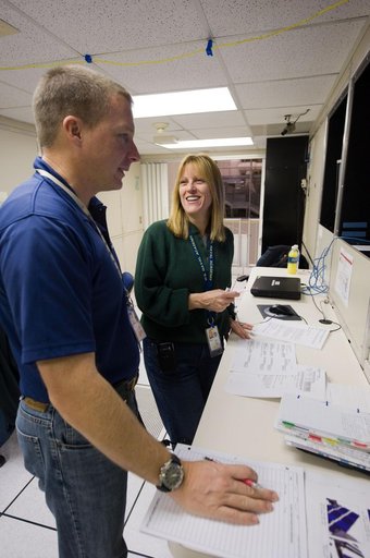 STS-130 crew members Kay Hire and Terry Virts training in the ISS Lab