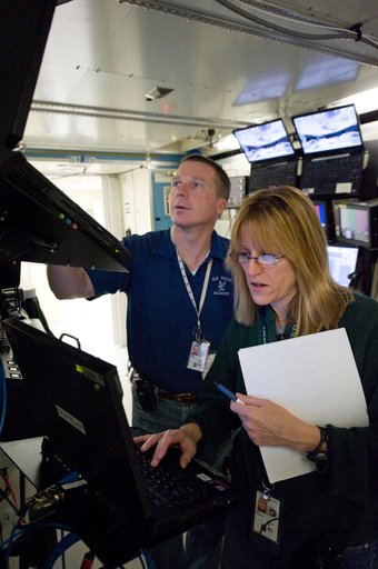 STS-130 crew members Kay Hire and Terry Virts training in the ISS Lab