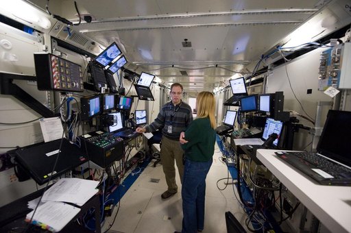 STS-130 crew members Kay Hire and Terry Virts training in the ISS Lab