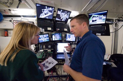 STS-130 crew members Kay Hire and Terry Virts training in the ISS Lab