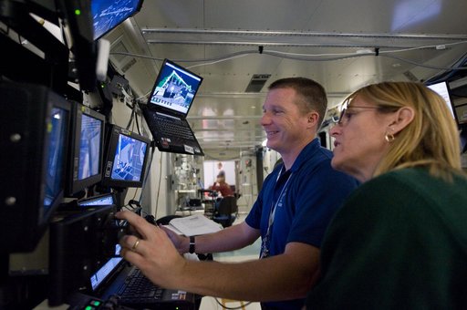 STS-130 crew members Kay Hire and Terry Virts training in the ISS Lab