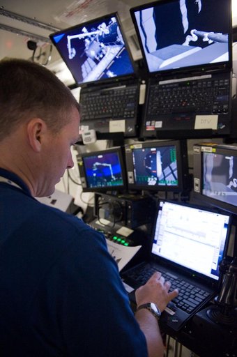 STS-130 crew members Kay Hire and Terry Virts training in the ISS Lab