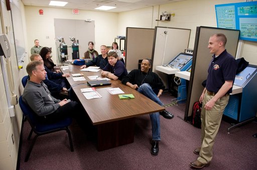 STS-133 crew during STS Response to Joint Emergency training with instructor Troy Williams