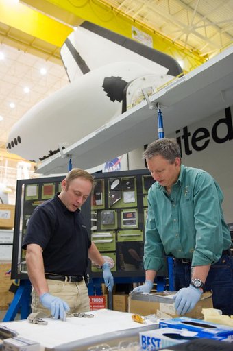 STS-134 crew members Mike Fincke, Drew Feustel and Greg Chamitoff performing EVA Tile Repair Training.