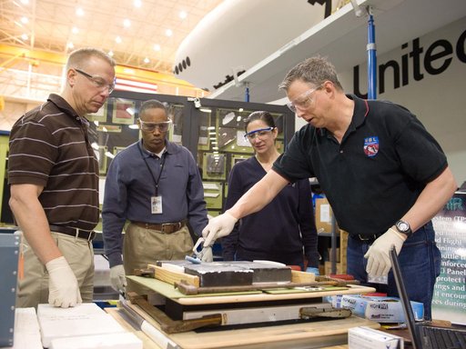 STS-133 crew members  Drew, Kopra and Stott during EVA Tile Repair.