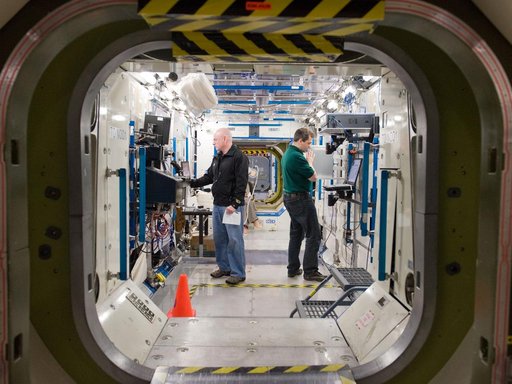 Expedition 25 crew members, Kaleri, Skripochka and S. Kelly during routine ops training.