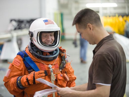 STS-133 crew during water survival training at the NBL
