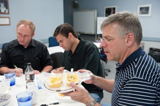 STS-134 crew during food tasting session in JSC Food Lab.