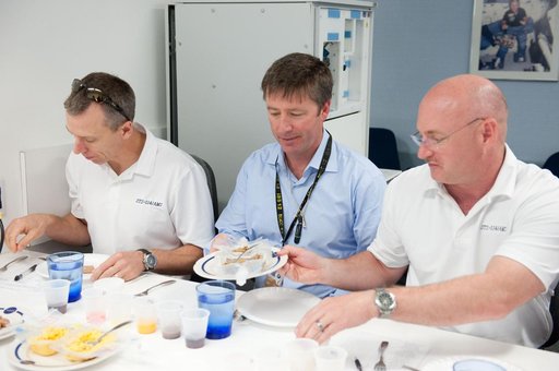 STS-134 crew during food tasting session in JSC Food Lab.