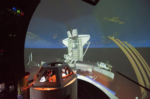 STS-133 crew members Mike Barratt and Nicole Stott in cupola