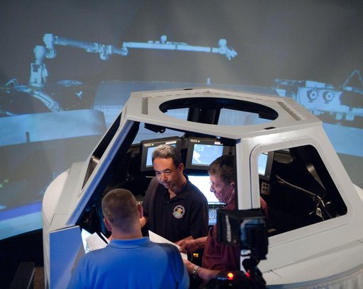 Satoshi Furukawa during FF RNDZ ADV1 training in the ISS cupola trainer in the SES dome.