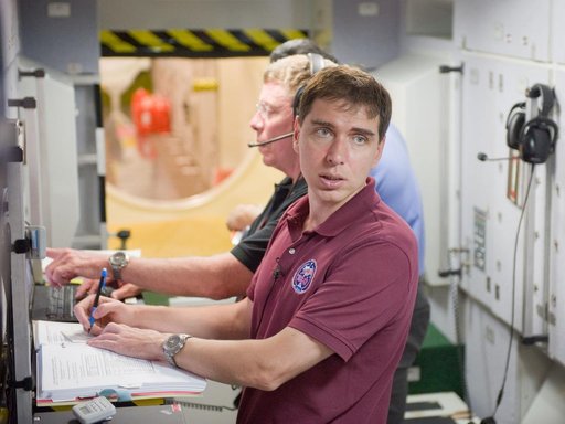 ISS 28 crew member Mike Fossum, Satoshi Furukawa, Sergei Volkov