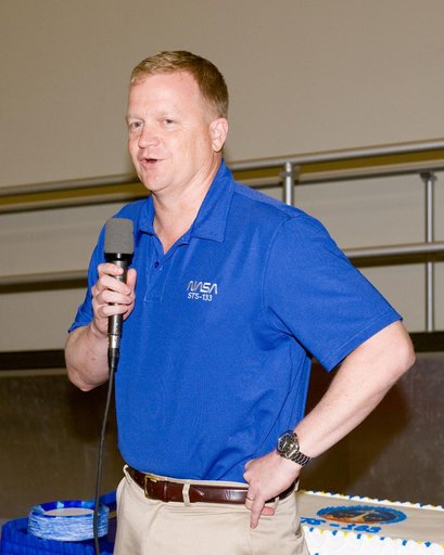 STS-133 cake cutting ceremony marking the end of their training.