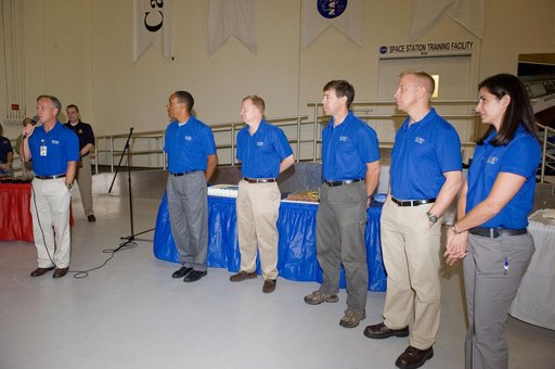 STS-133 cake cutting ceremony marking the end of their training.
