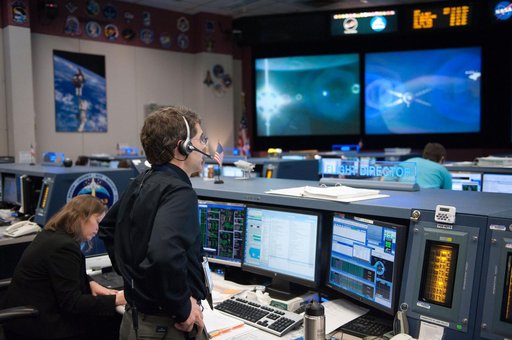ISS Orbit 2 flight controllers on console with Flight Director Bob Dempsey