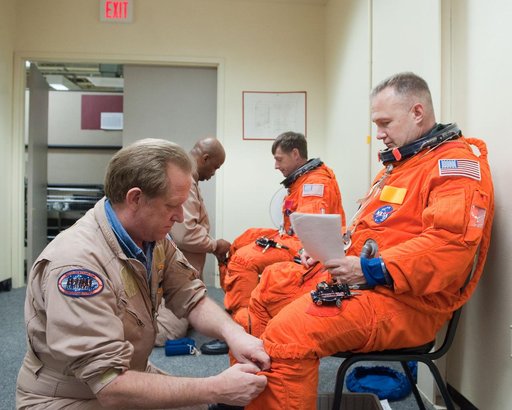 STS-135 Crew during prep and insertion into Fixed Base Simulator