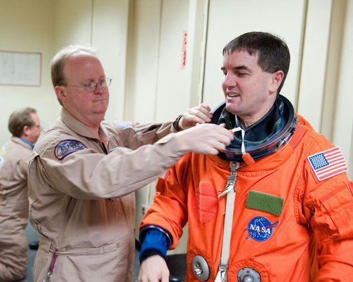 STS-135 Crew during prep and insertion into Fixed Base Simulator