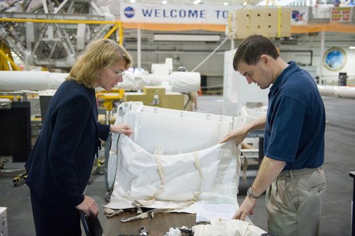 STS-135 crew members Rex Walheim and Sandra Magnus during EVA TPS OPS at 1G Trainer at the NBL.