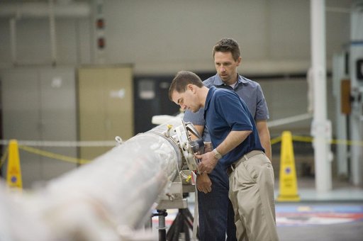 STS-135 crew members Rex Walheim and Sandra Magnus during EVA TPS OPS at 1G Trainer at the NBL.