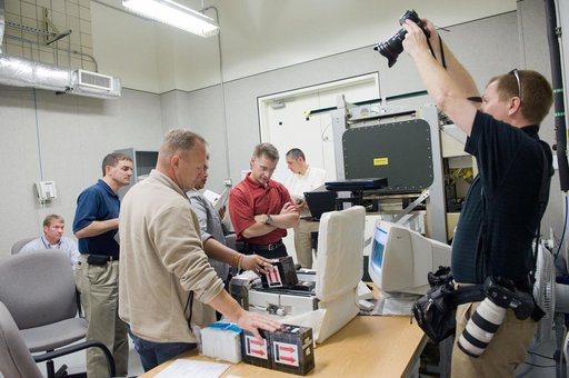 STS-135 crew during various training exercises in Space Station Training Facility