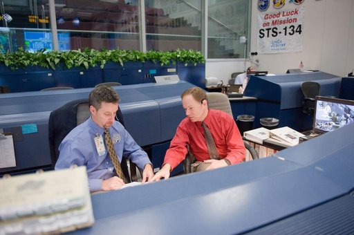 STS-134 Orbit 1 flight controllers on console during AMS install