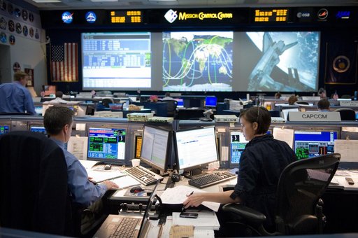 STS-134 Orbit 1 flight controllers on console during AMS install