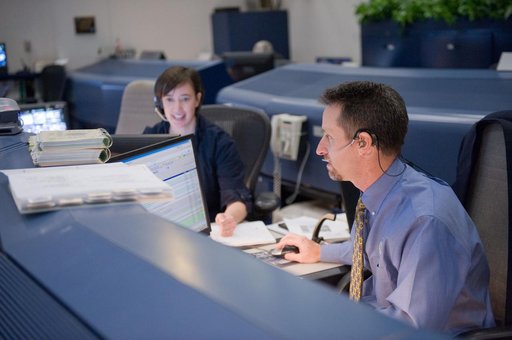 STS-134 Orbit 1 flight controllers on console during AMS install