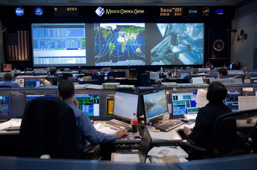 STS-134 Orbit 1 flight controllers on console during AMS install