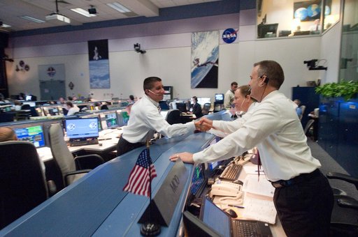 STS135 flight controllers on console during last shuttle mission