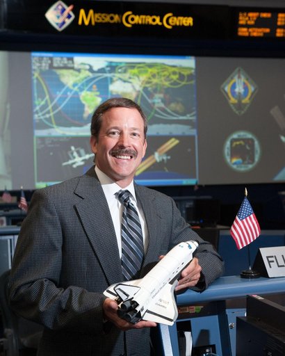 STS-135 Flight Controllers on Console