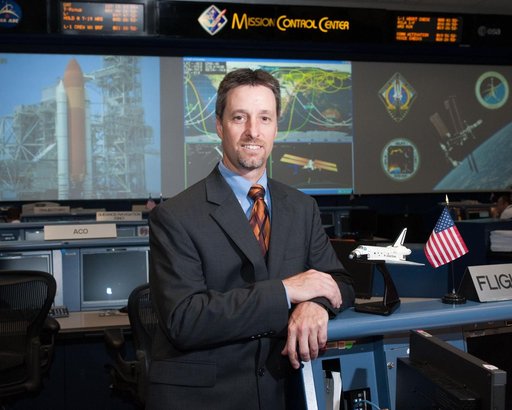 STS-135 Flight Controllers on Console