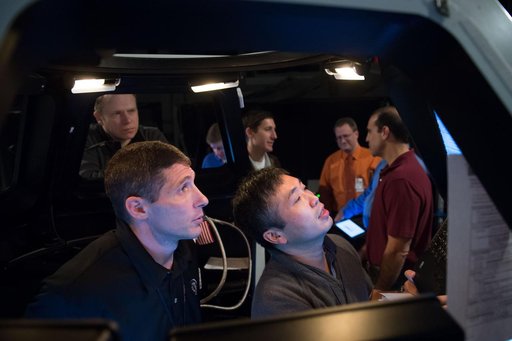Expedition 39 (Soyuz 37) crew members in the building 16 dome