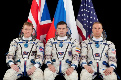 Expedition 44 backup crew ESA (European Space Agency) astronaut Timothy Peake (left),  Russian cosmonaut Yuri Malenchenko (ROSCOSMOS) (center), and NASA astronaut Timothy L. Kopra