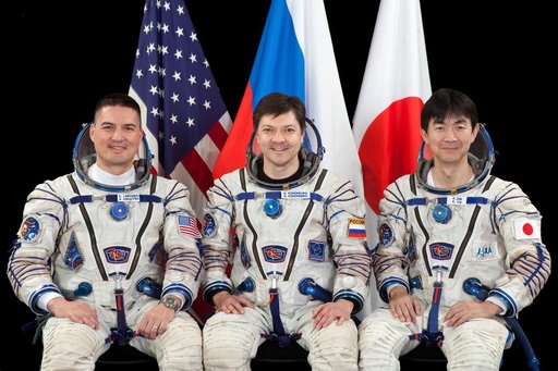 Expedition 44 crew members NASA astronaut Kjell Lindgren (left), Russian cosmonaut Oleg Kononenko (center) and Japan Aerospace Exploration Agency (JAXA) astronaut Kimiya Yui.