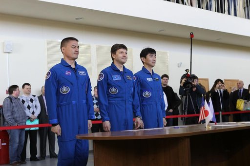 CG4G8889 --- (6 May 2015) --- At the Gagarin Cosmonaut Training Center in Star City, Russia, Expedition 44/45 crewmembers Kjell Lindgren of NASA (left), Oleg Kononenko of the Russian Federal Space Agency (Roscosmos, center), and Kimya Yui of the Japan Aerospace Exploration Agency (right) appear befo