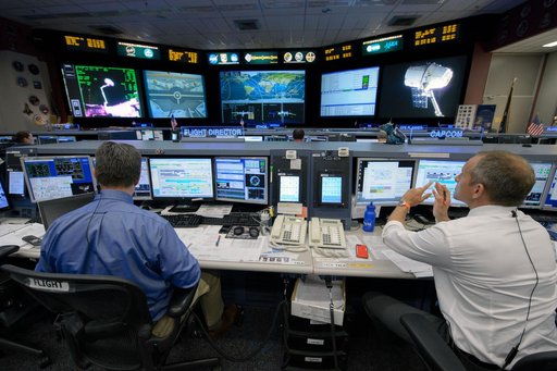 Expedition 43 flight control team with Flight Director Gary Horlacher during the release of SpaceX Dragon cargo vehicle.  Photo Date: May 21, 2015.  Location: Building 30 - FCR1.  Photographer: Robert Markowitz